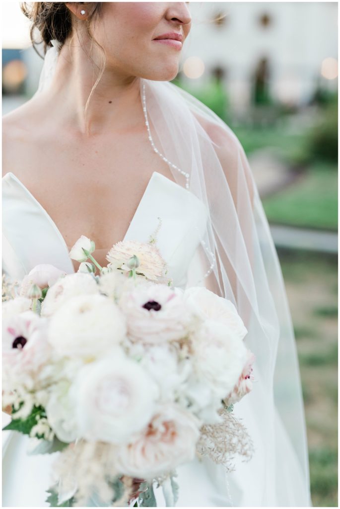bridal details shot with strapless gown and white bouquet
