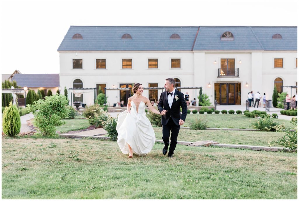 bride and groom running off together after elegant european chic wedding day in eagle, idaho 