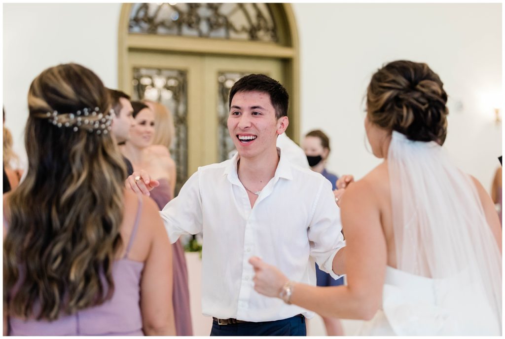 wedding guests dancing with bridal party