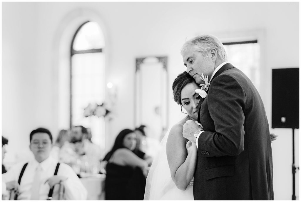 bride dancing with father during father daughter dance at wedding reception in idaho
