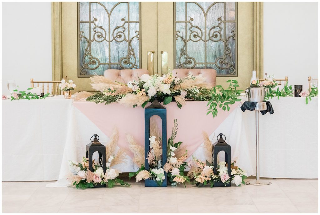 head table blush and greenery filled wedding table with accents of gold at european chic wedding 