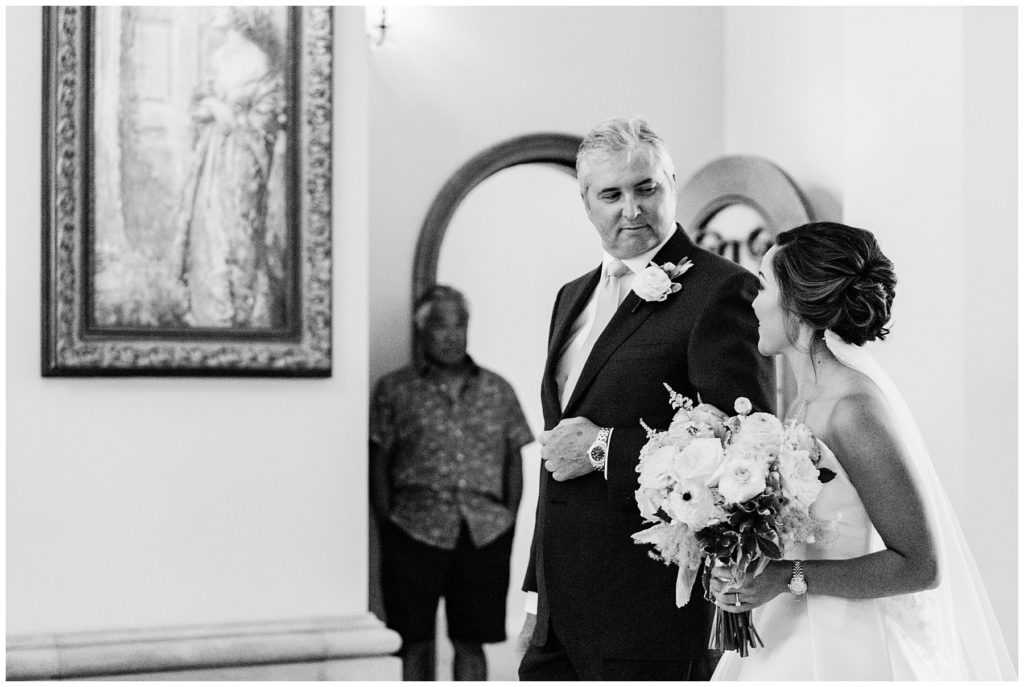 bride being walked down aisle by father on wedding day