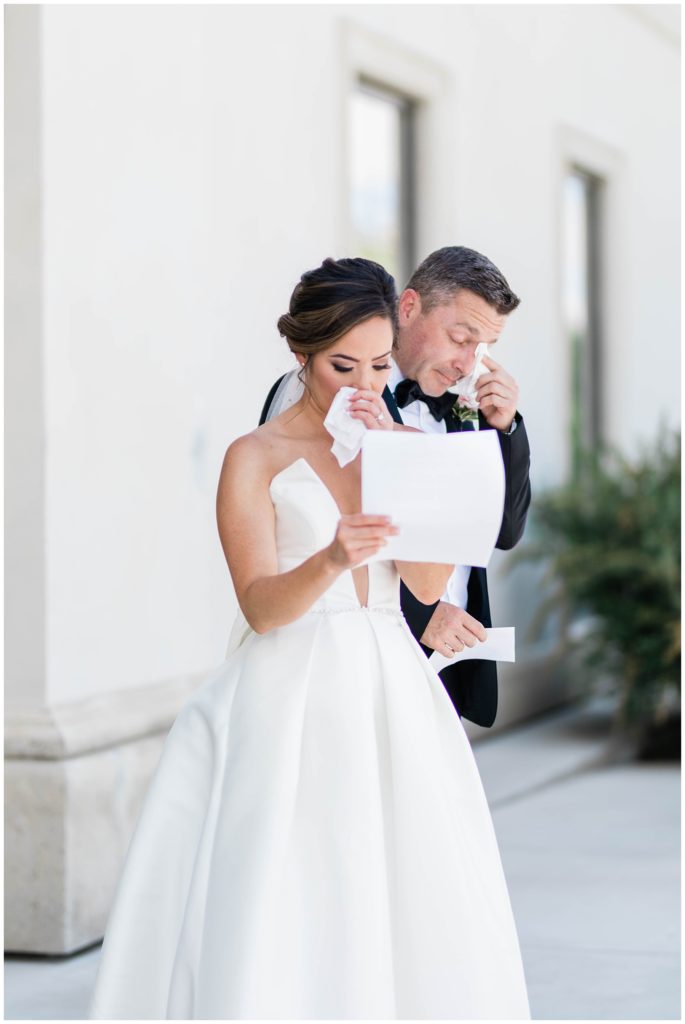 bride and groom getting emotional while reading letters on wedding day in Eagle Idaho
