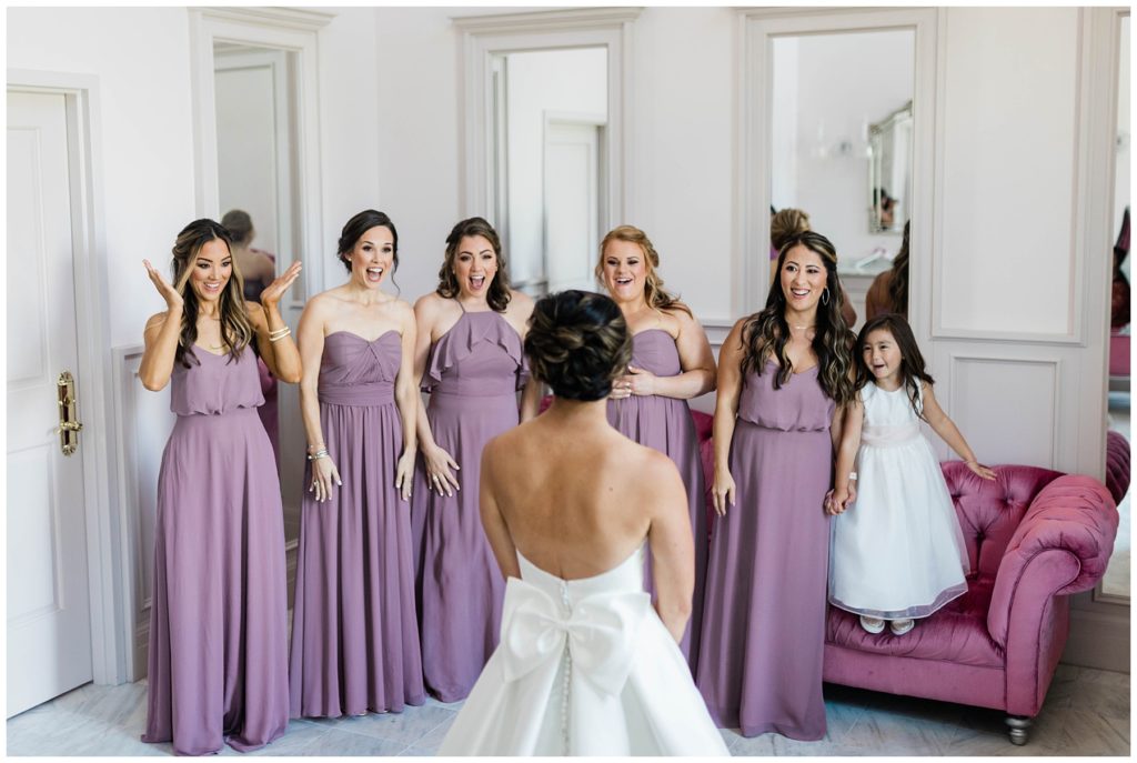 bride during first look with bridesmaids