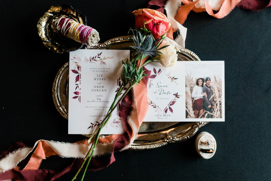 whimsical still water hollow wedding featuring moody boho inspired wedding invitations, sage, and florals