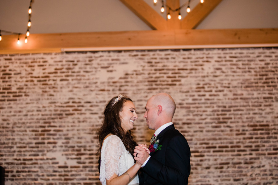 bride and groom dancing during first dance at whimsical still water hollow reception