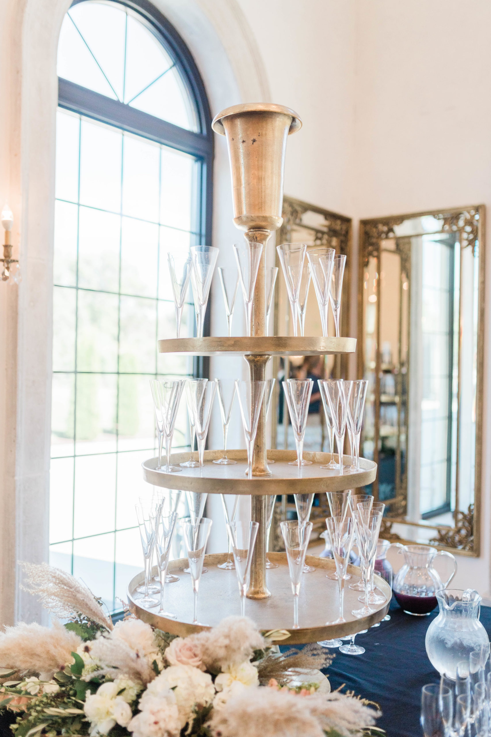 champagne tower at indoor wedding reception in Boise for an elegant summer wedding