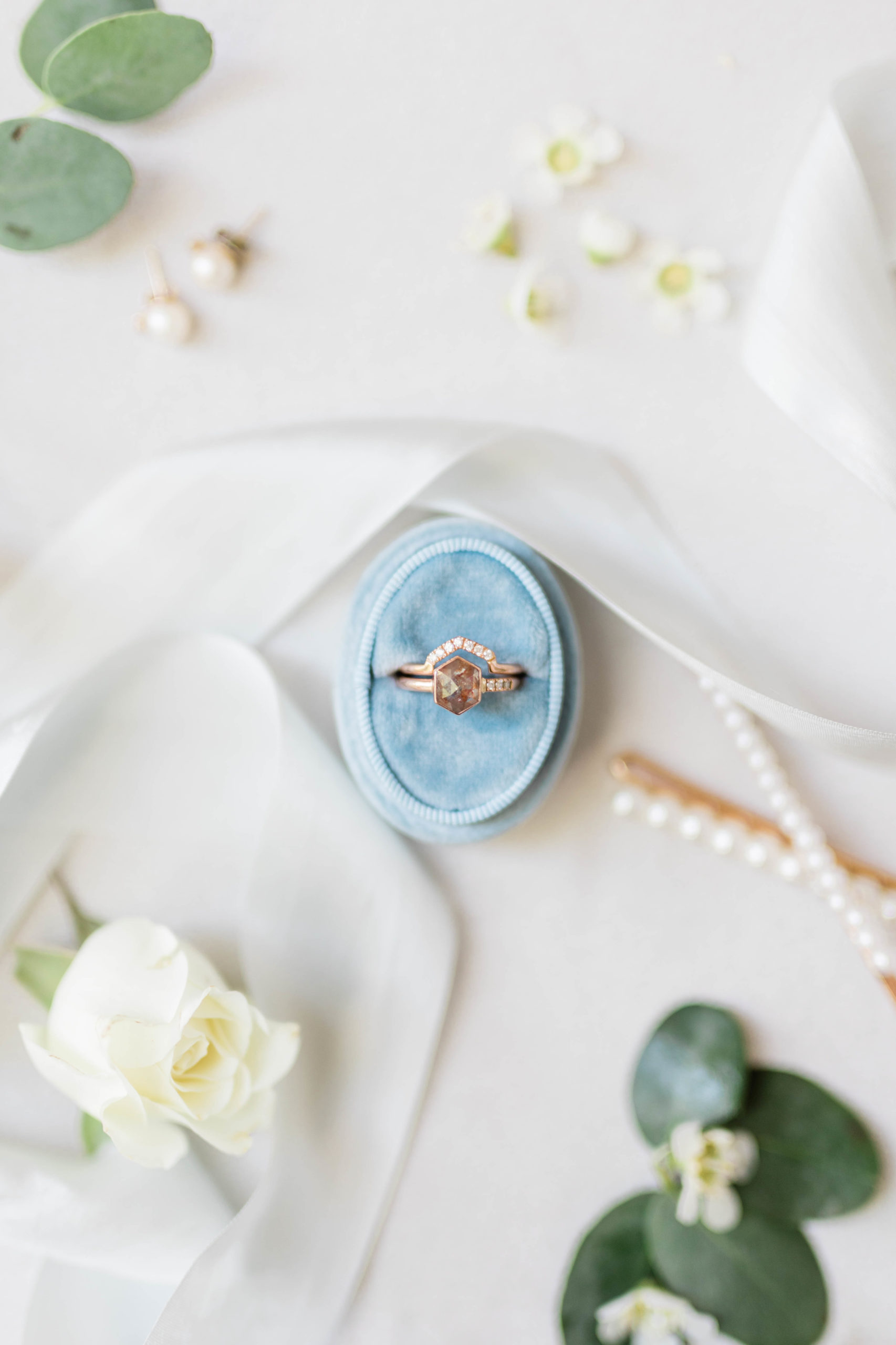 engagement ring detail shot in a light blue wedding ring box