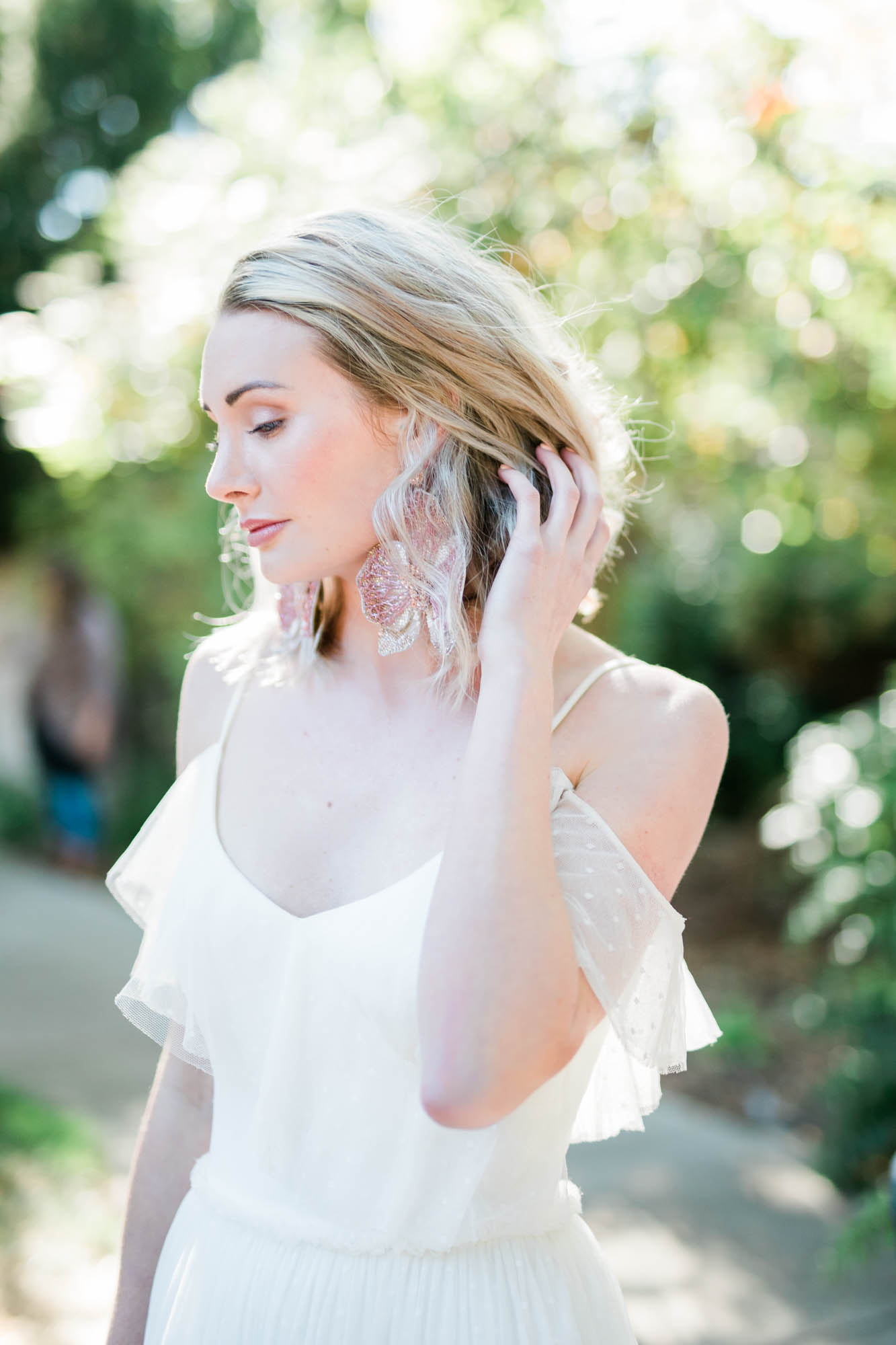 bridal portrait with blonde bride in a boho wedding gown at outdoor Boise wedding venue, captured by best Boise wedding photographer