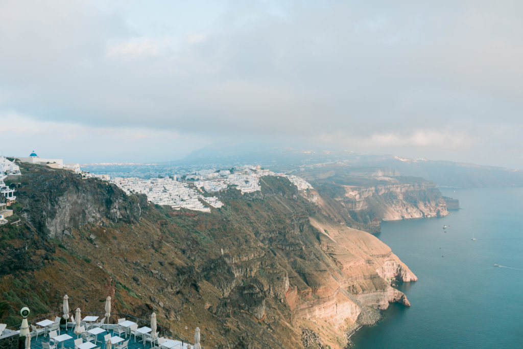 Santorini coast like with cliffs and city skyline 
