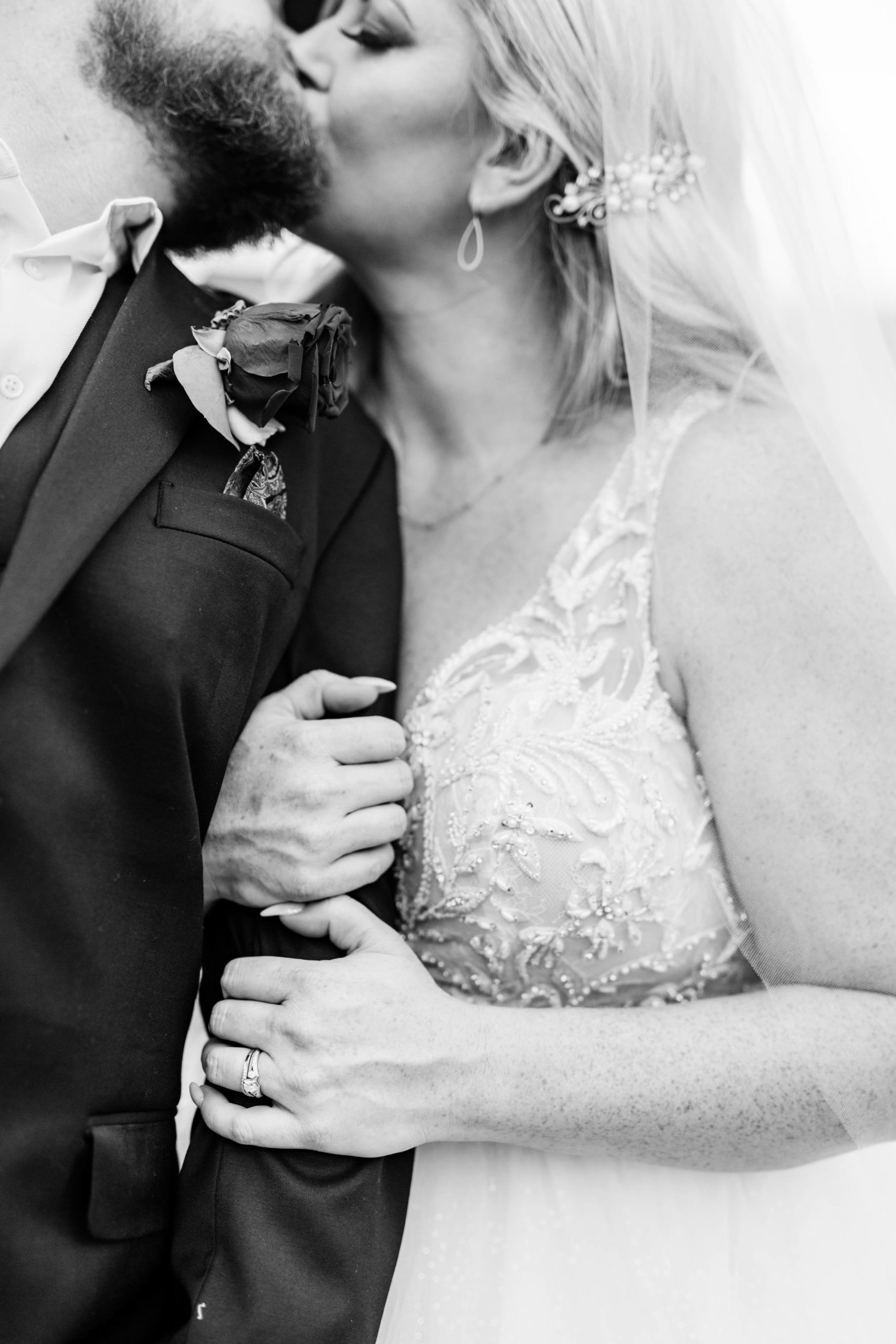 black and white wedding pictures with bride and groom kissing taken by Boise Wedding Photographer