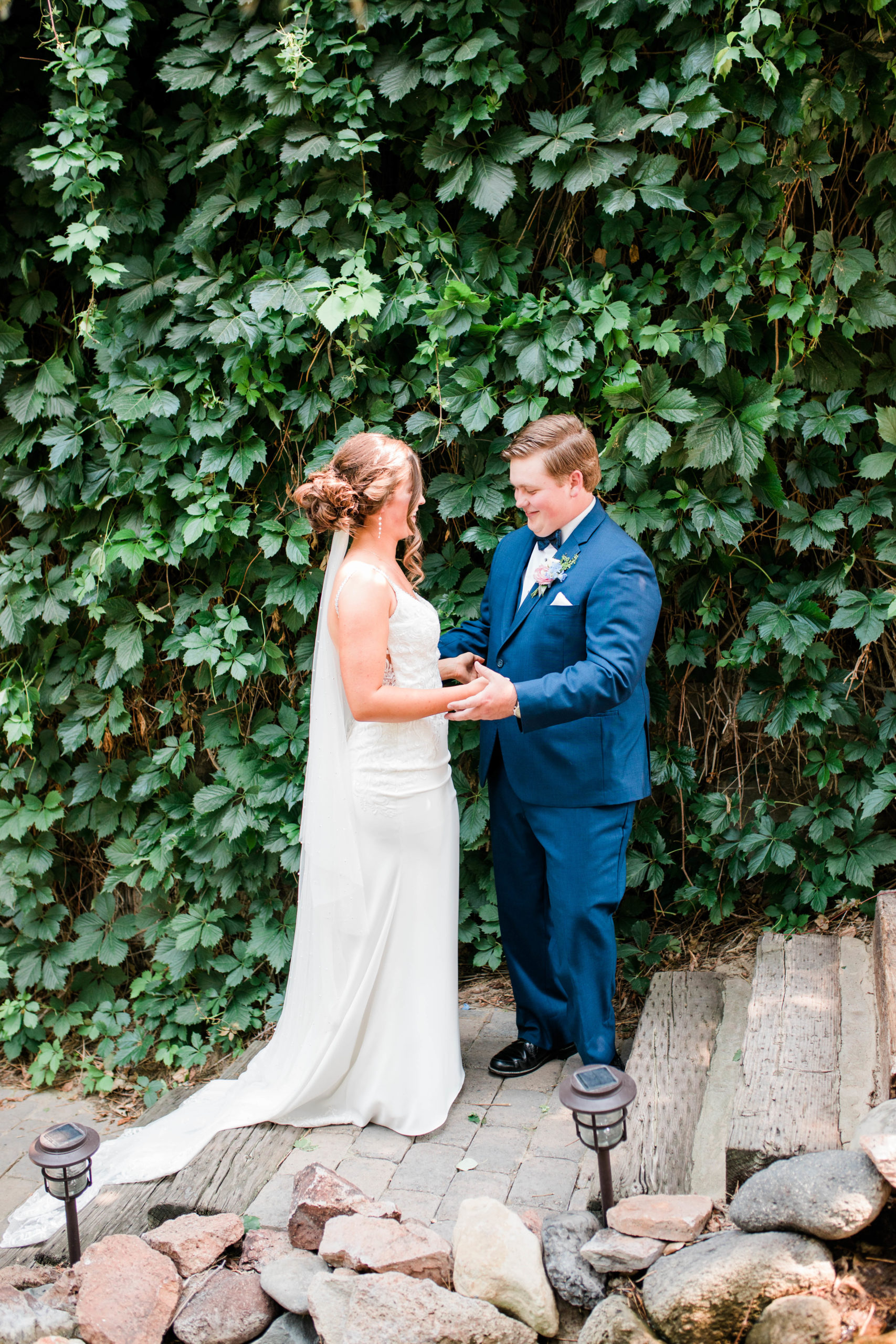 private wedding day first looks with bride and groom in a secret garden at a Boise wedding venue