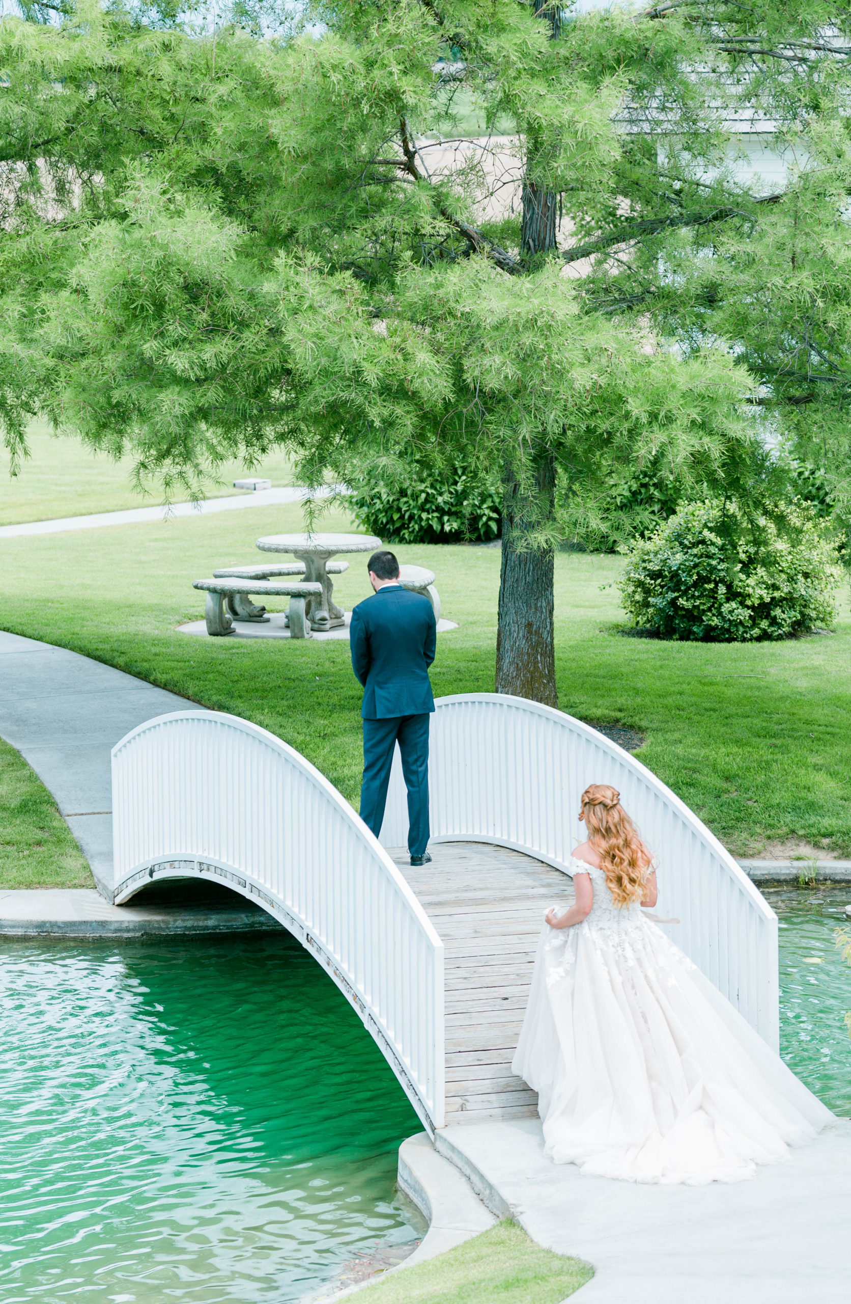 bride approaching her groom for their first look at their outdoor wedding venue in Nampa Idaho 