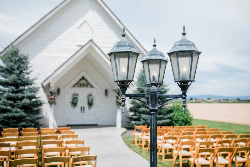 Still Water Hollow wedding chapel with wood chairs set up for outdoor wedding ceremony