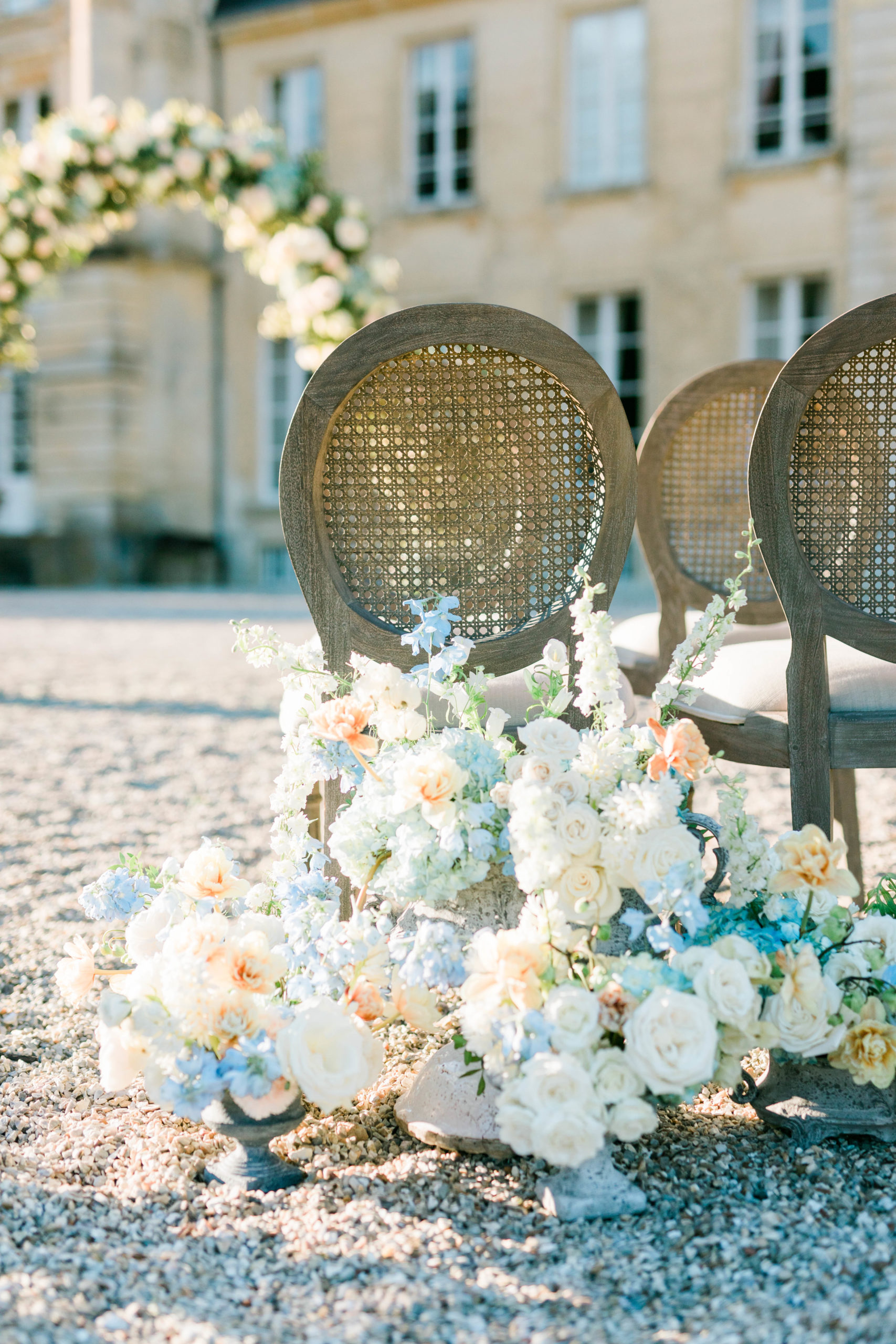 florals around chairs during ceremony at destination wedding in Paris