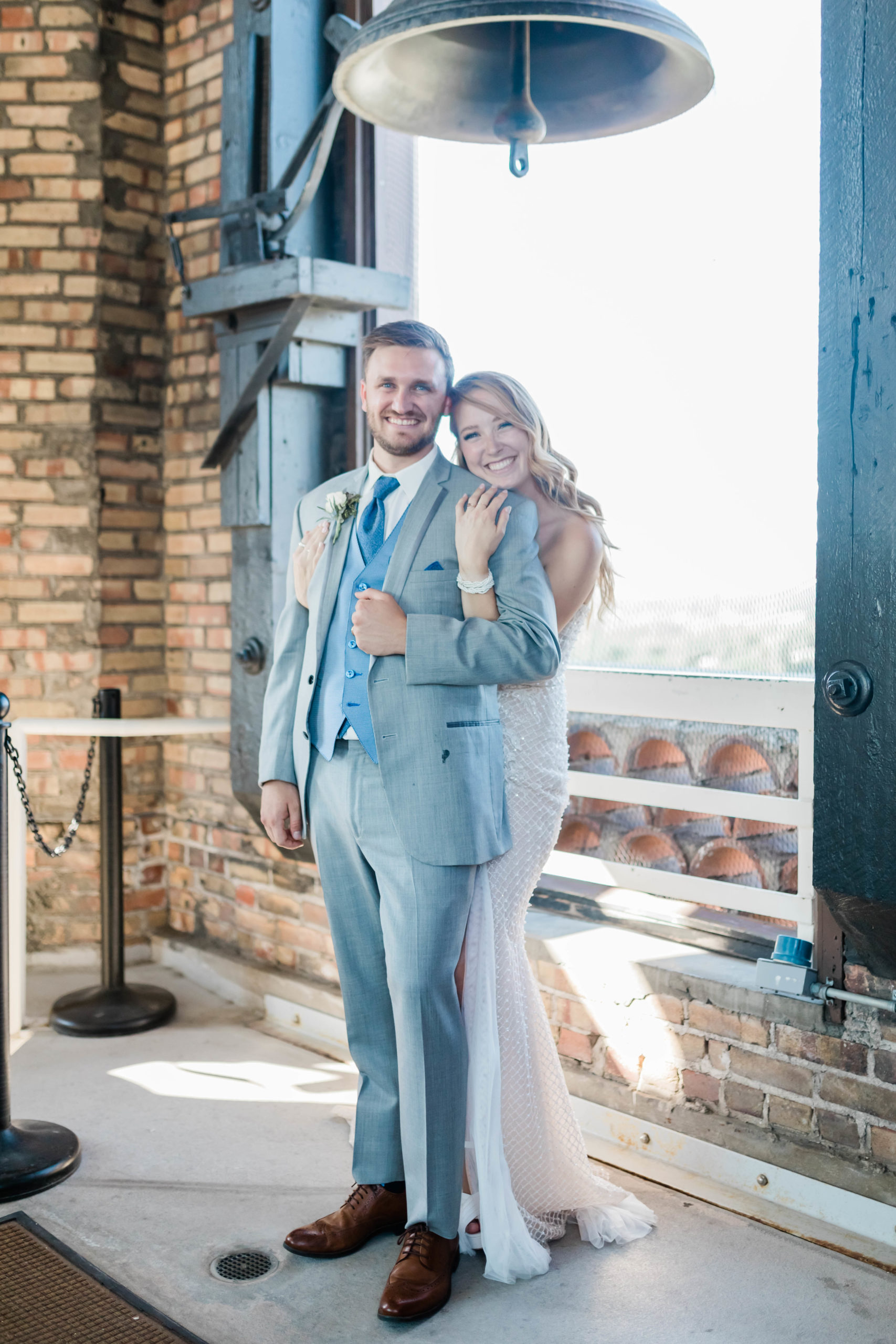 bride and groom in a bell tower for their Boise bridal photos