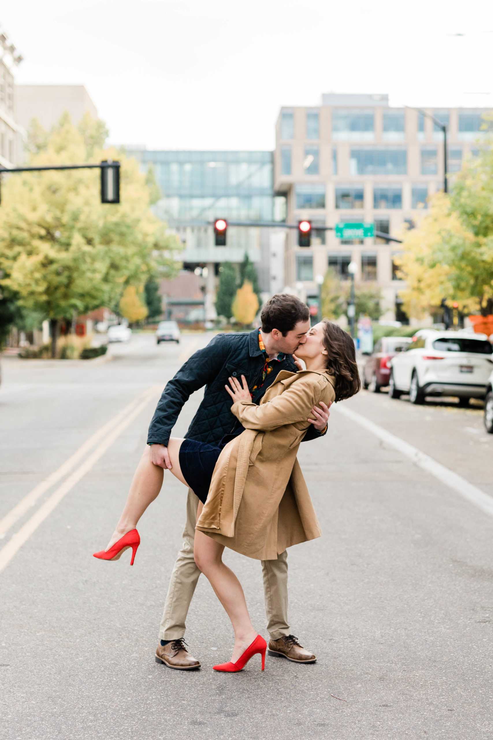 Boise wedding photographer captures engaged couple kissing in the streets