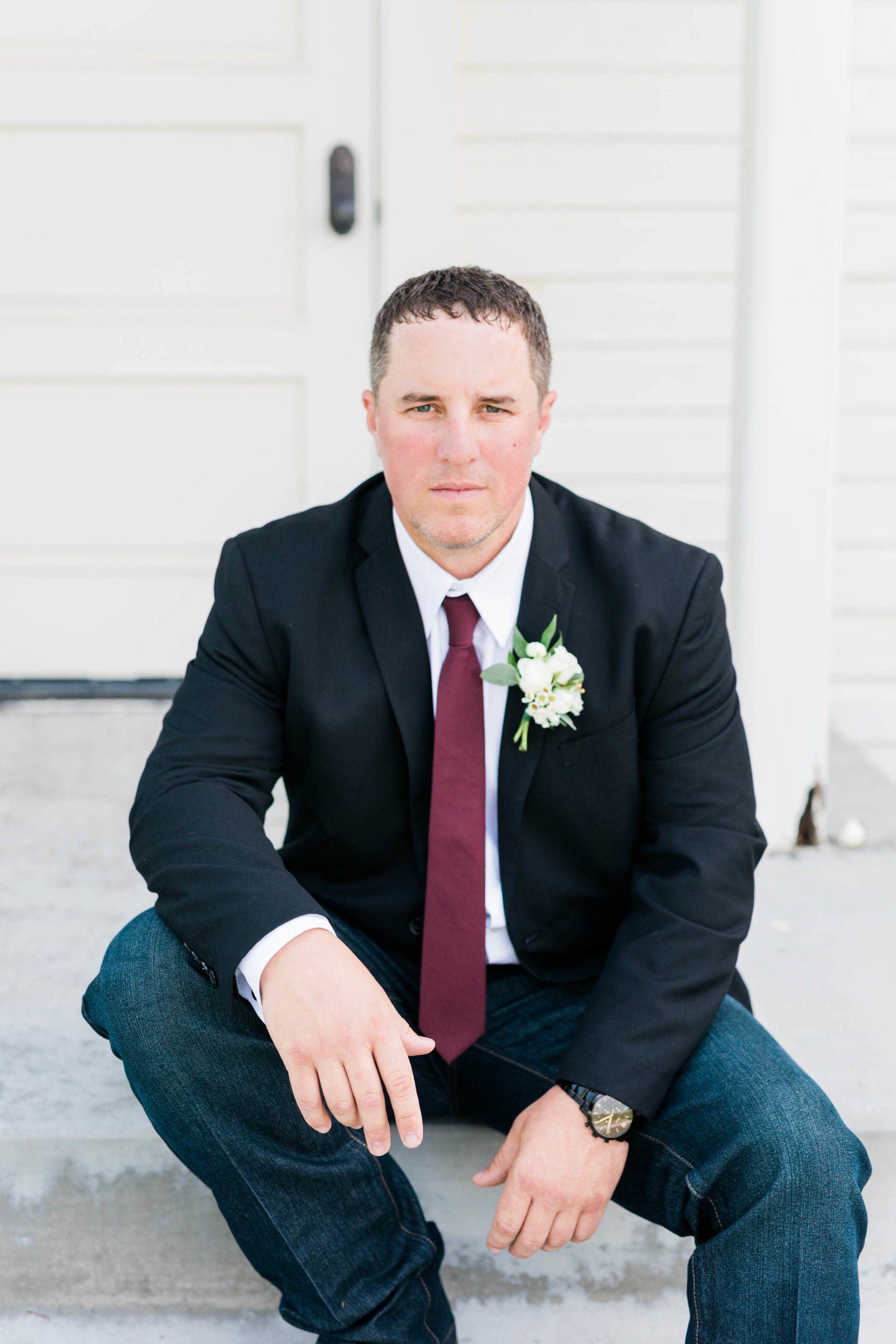 groom sitting on stairs before still water hollow