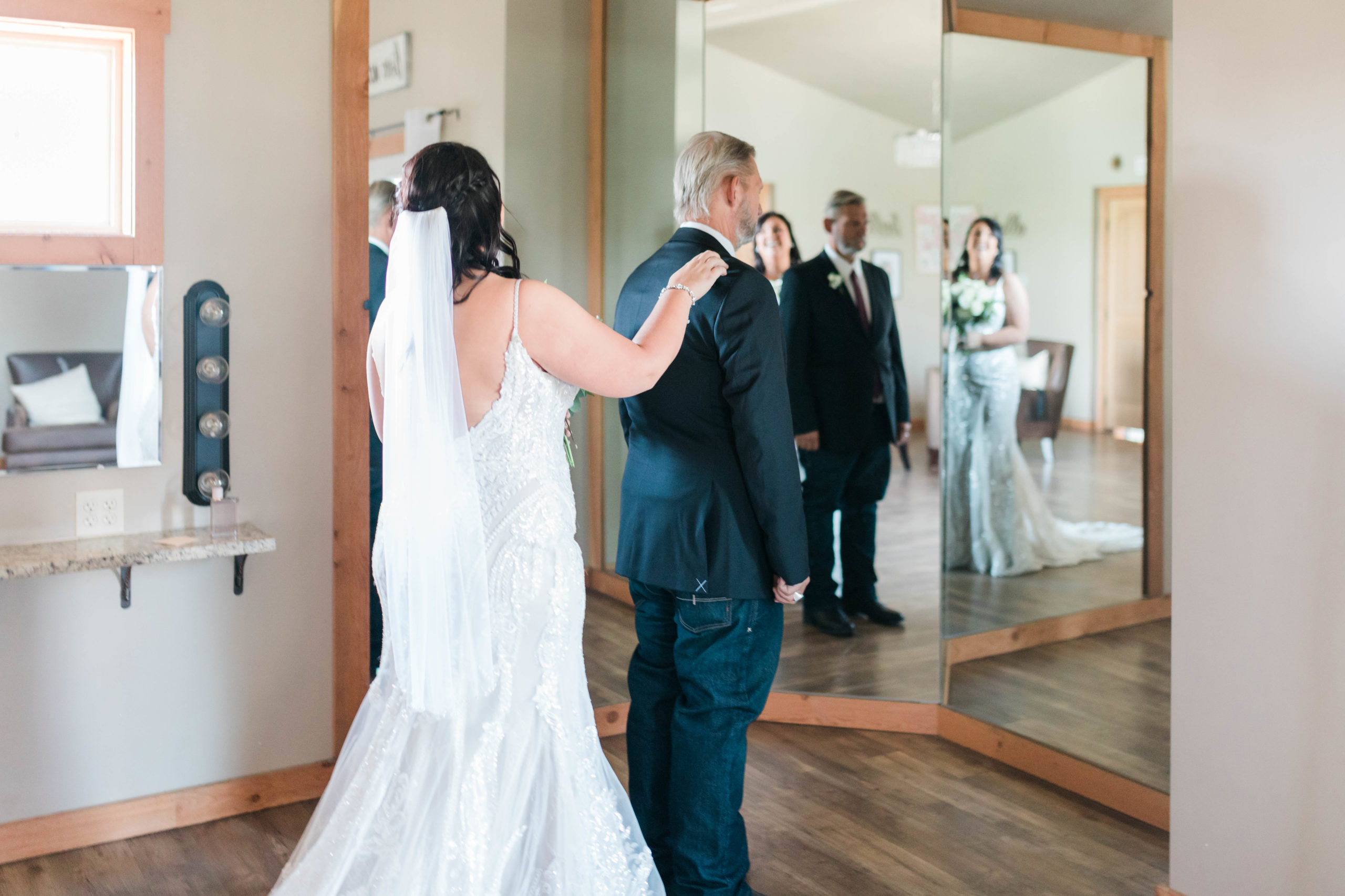 Boise wedding photographer captures bride tapping father's shoulder before first look