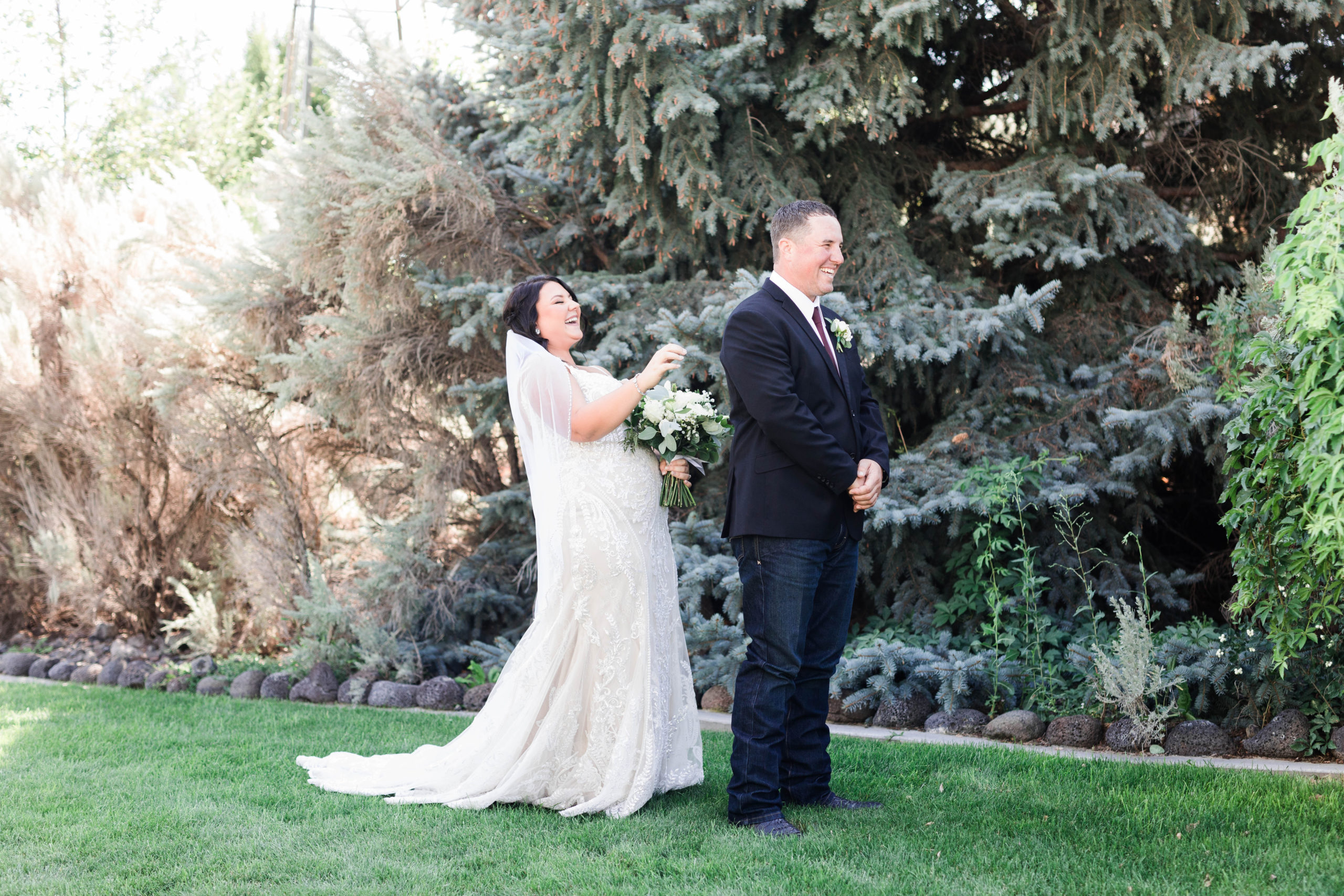 Boise wedding photographer captures bride and groom laughing during first look