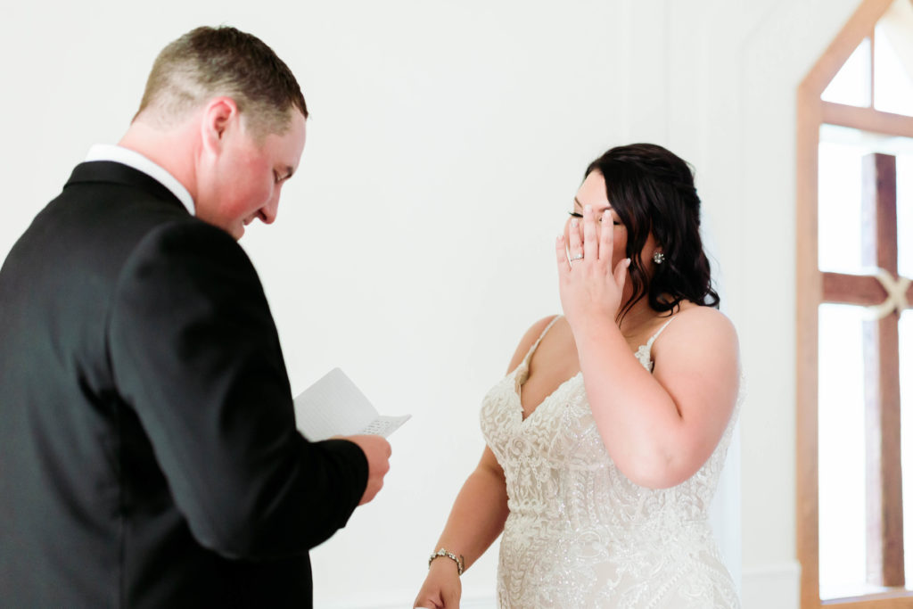 bride crying after groom reads vows 
