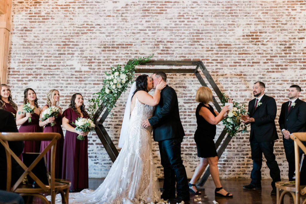 Boise wedding photographer captures bride and groom kissing after wedding