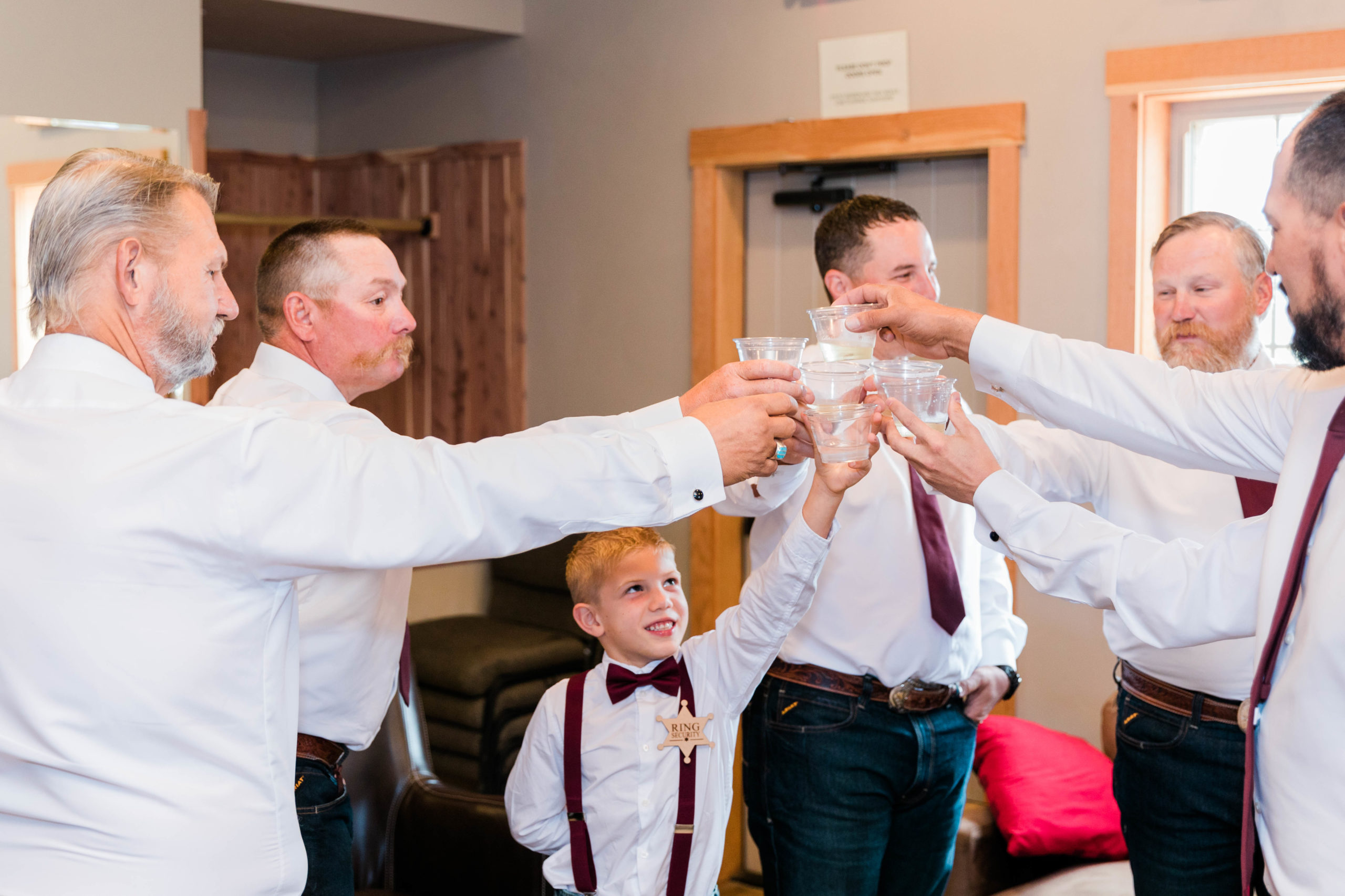 groom toasting before still water hollow wedding