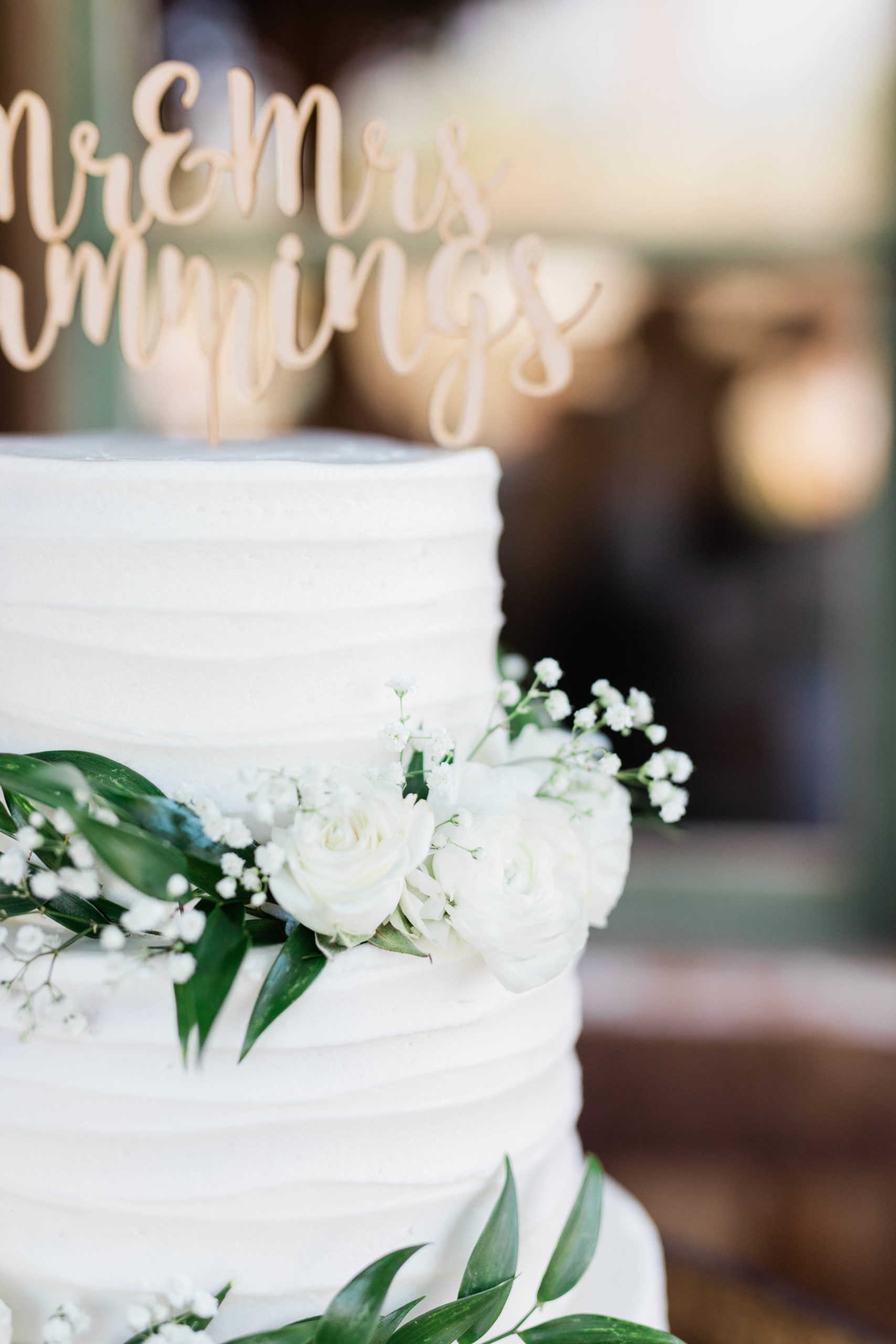 close up of three tiered wedding cake