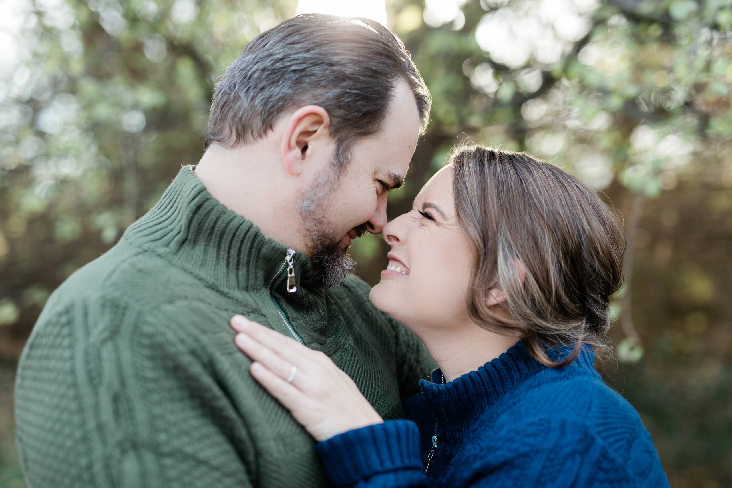 Boise wedding photographer captures woman smiling at man while noses are pressed together