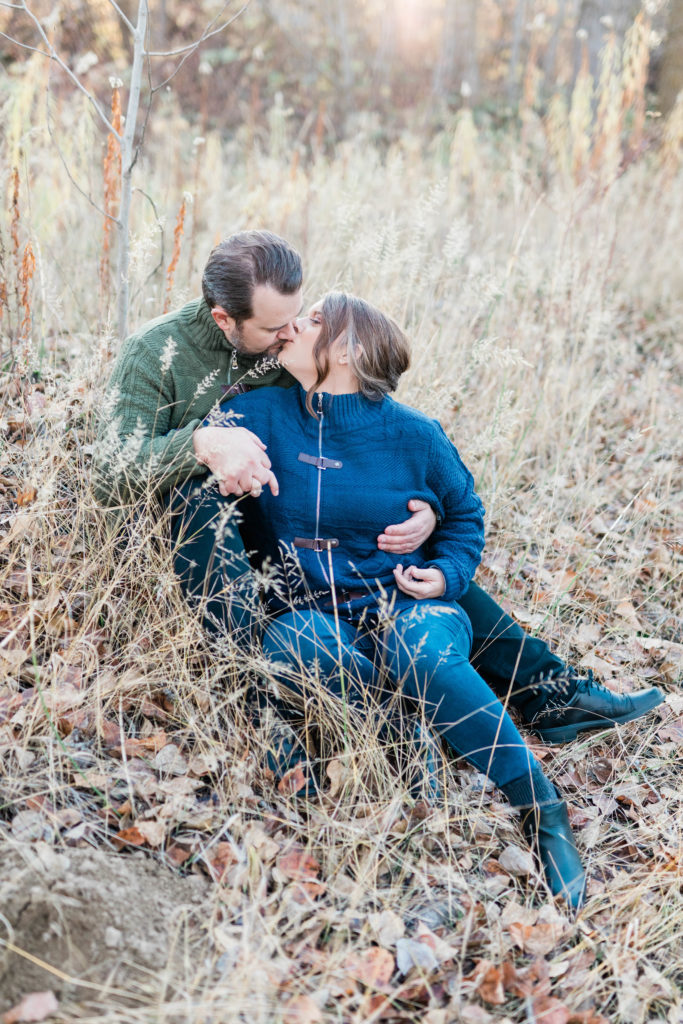 Boise wedding photographer captures man and woman kissing in grass