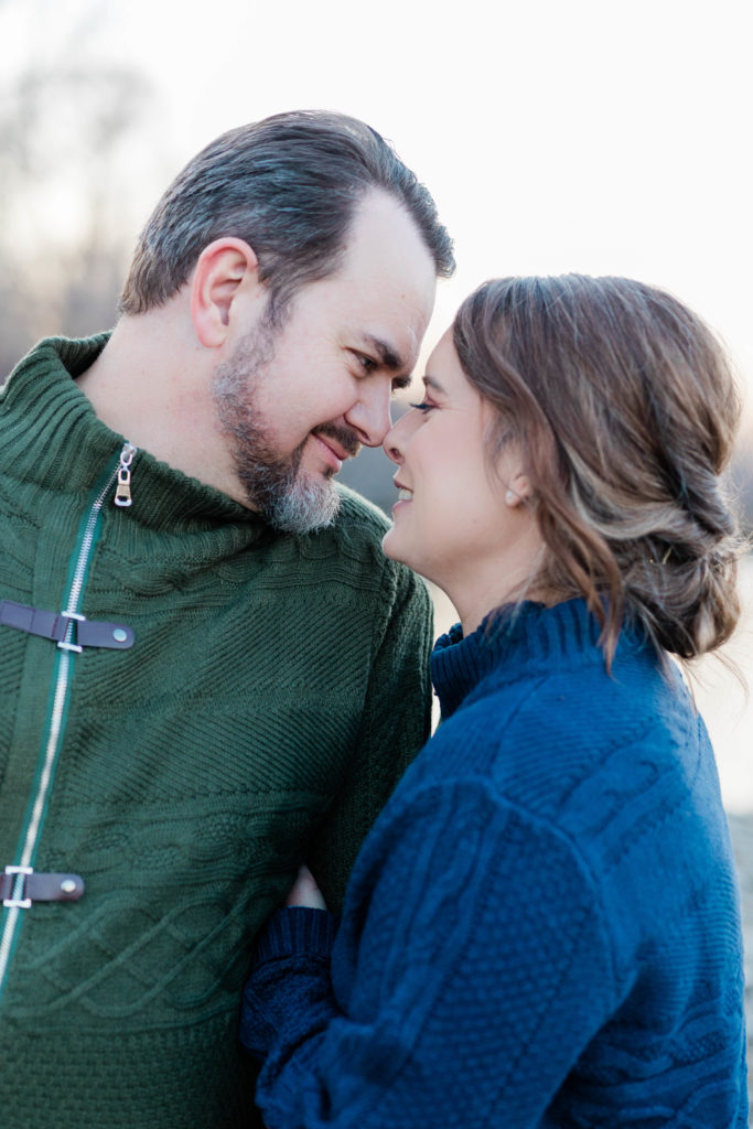 Boise wedding photographer captures newly engaged couple noses together during fall engagement session