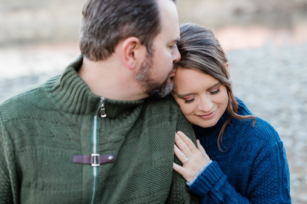 Boise wedding photographer captures man and woman embracing during fall engagement session