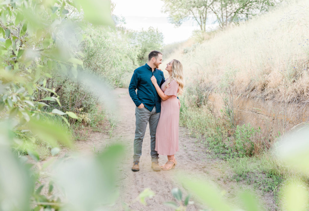 Boise wedding photographer captures couple during engagement session embracing and enjoying time together