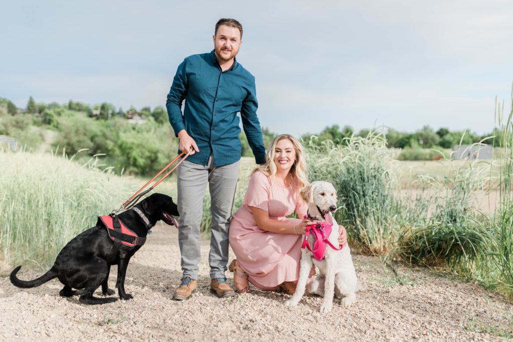 Boise wedding photographer captures newly engaged couple posing with puppies
