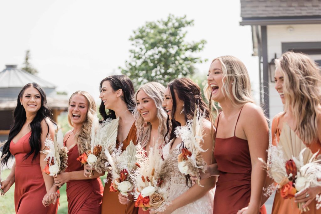 boise wedding photographer captures bridal party wearing boho mismatched bridesmaid dresses