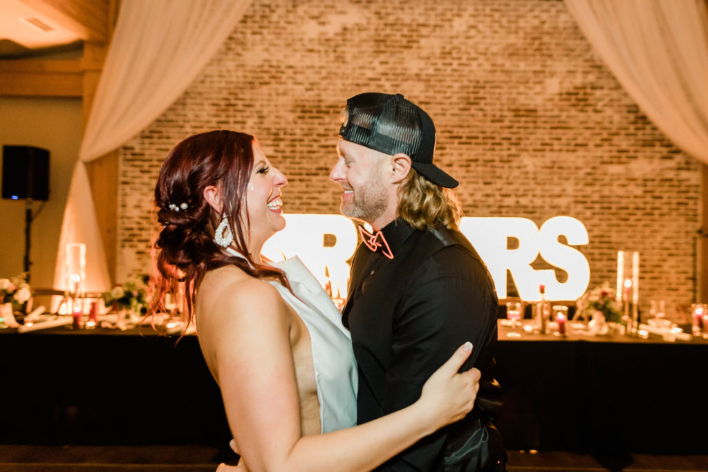 Boise wedding photographer captures bride and groom celebrating during wedding reception