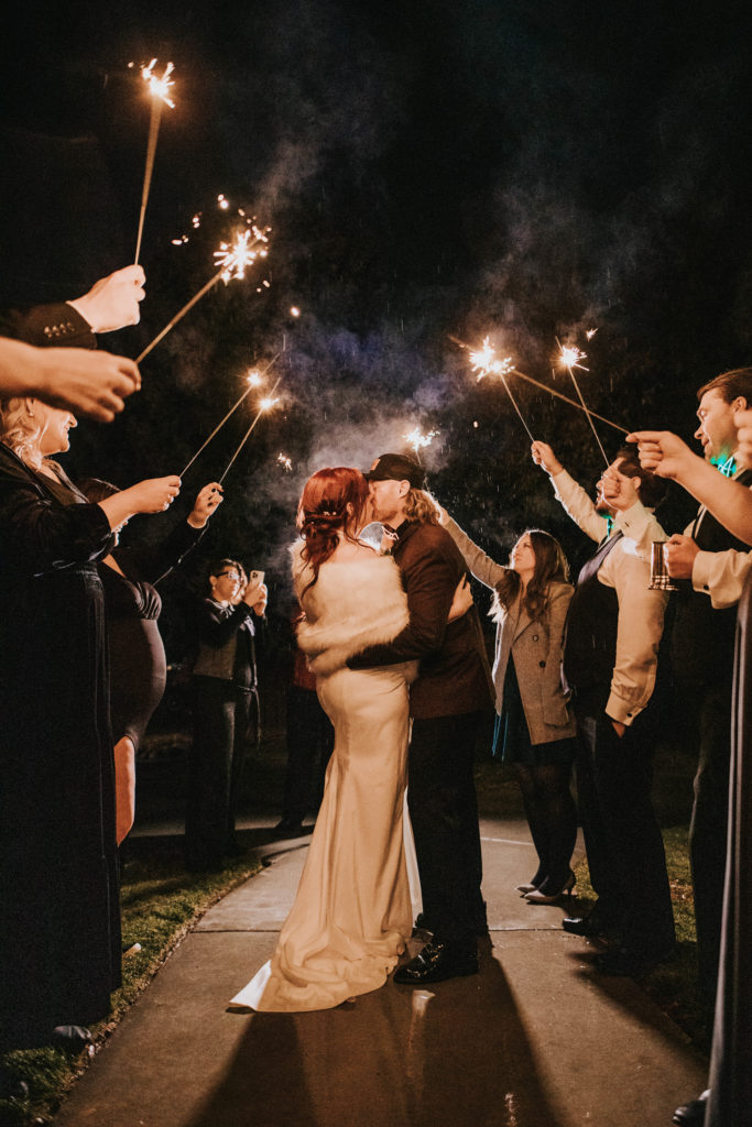 Boise wedding photographer captures couple kissing during exit