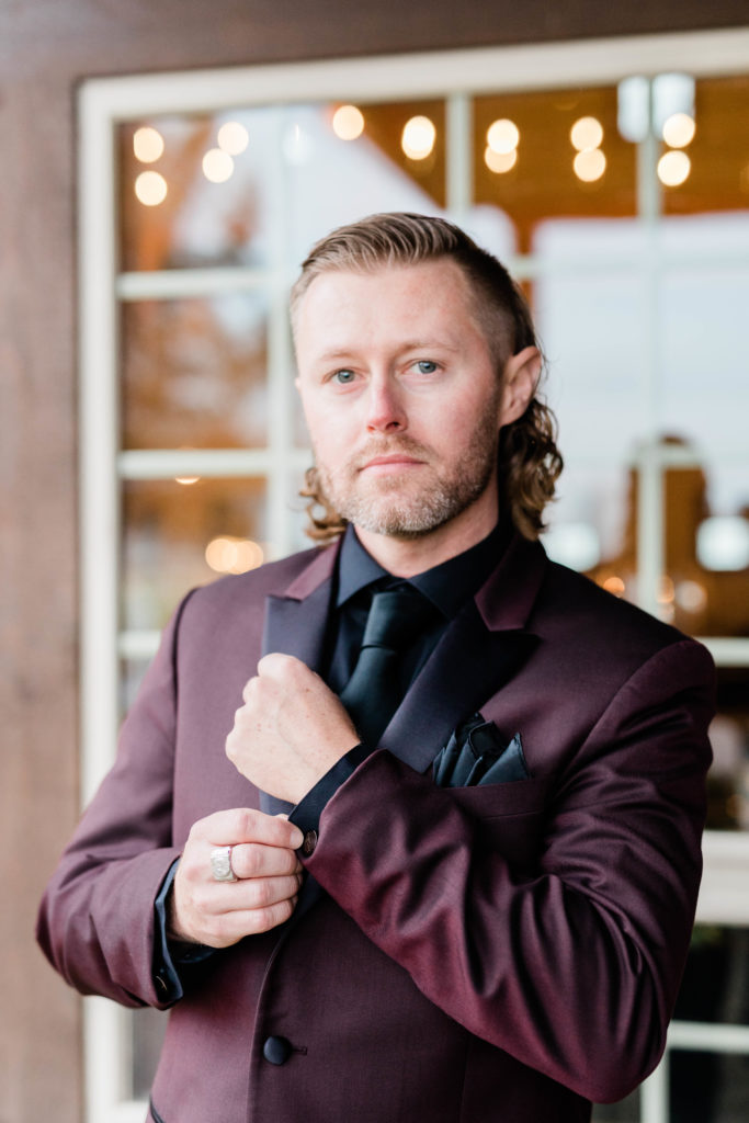 Boise wedding photographer captures groom putting on cufflinks