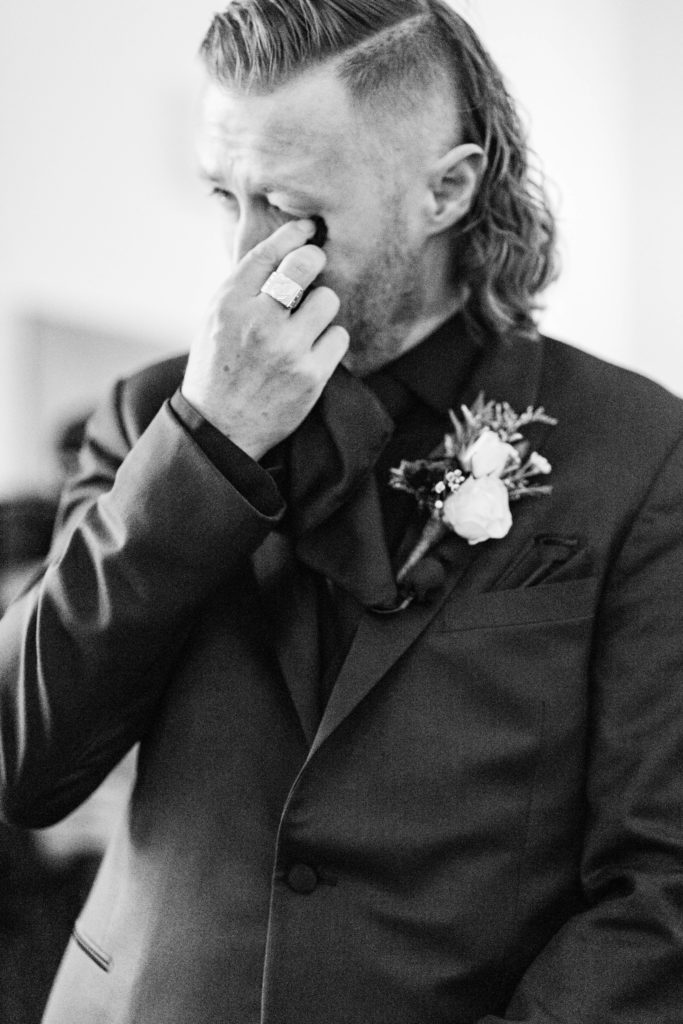 Boise wedding photographers capture groom crying as bride walks down aisle