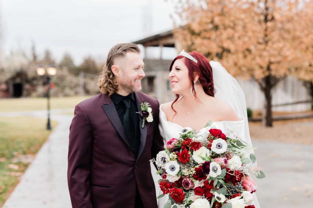Boise wedding photographers capture bride and groom walking together 