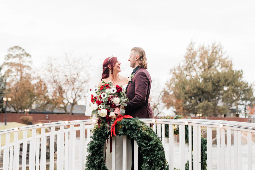Boise wedding photographers capture bride and groom on bridge together