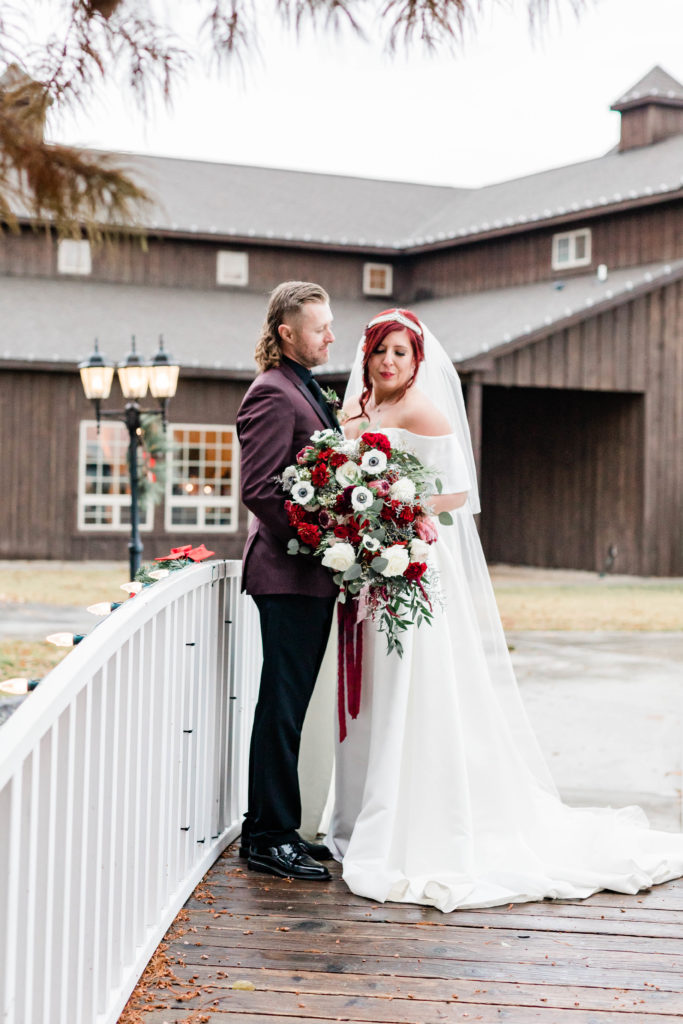 Boise wedding photographers capture bride and groom standing together wearing bridal attire