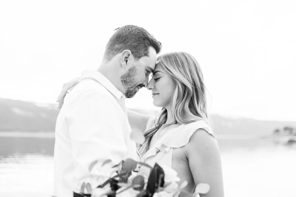 Boise wedding photographer captures black and white portrait of couple touching noses