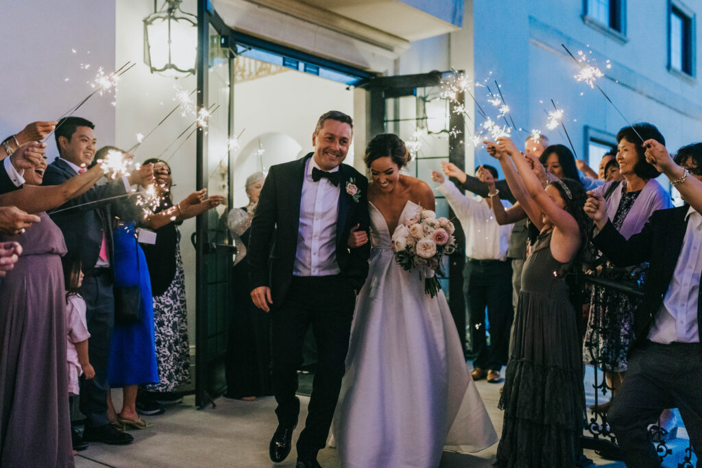 Boise wedding photographers capture bride and groom during sparkler wedding exit