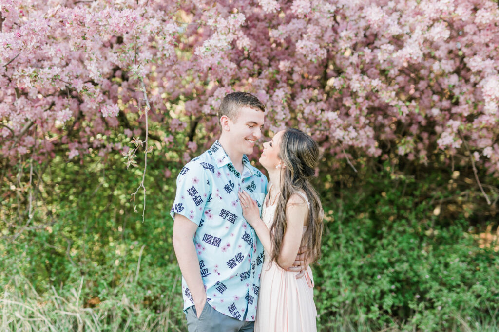 Boise wedding photographer captures couple standing together during spring engagement session