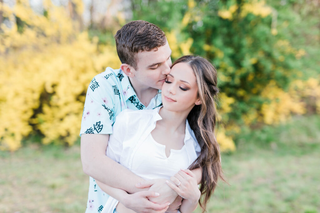 Boise wedding photographer captures couple embracing during spring engagement photos