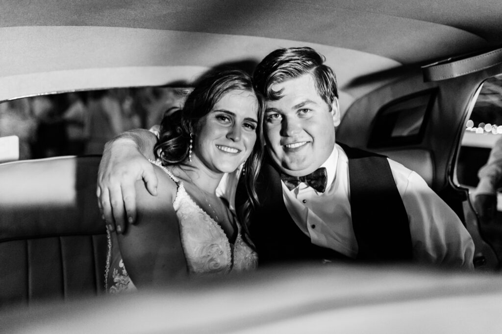 Boise wedding photographer captures couple riding away in vintage car