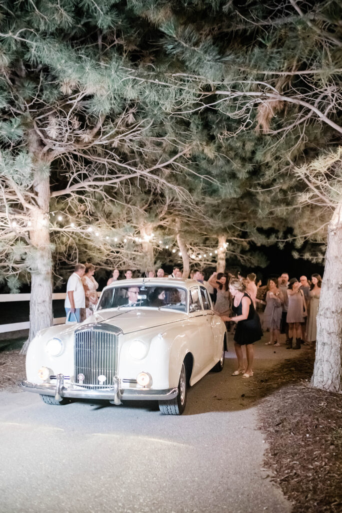 Boise wedding photographer captures vintage car getaway for wedding couple