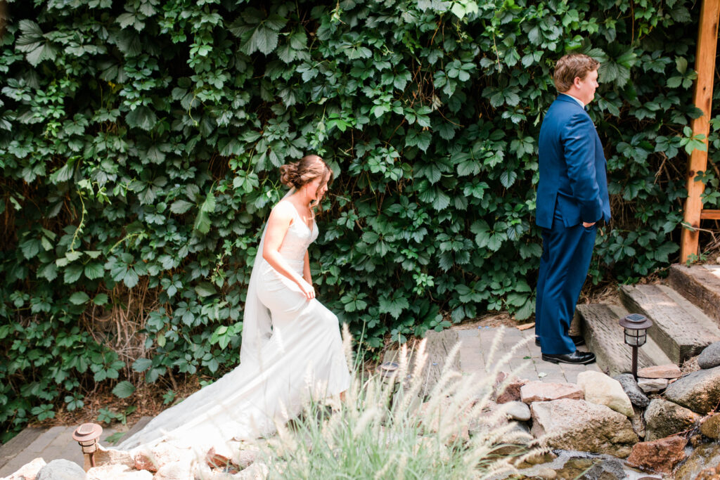 Boise wedding photographers capture bride walking up to groom before first look