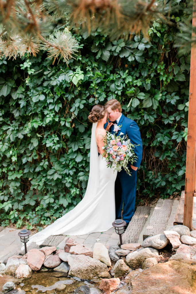 Boise wedding photographer captures couple kissing after first look